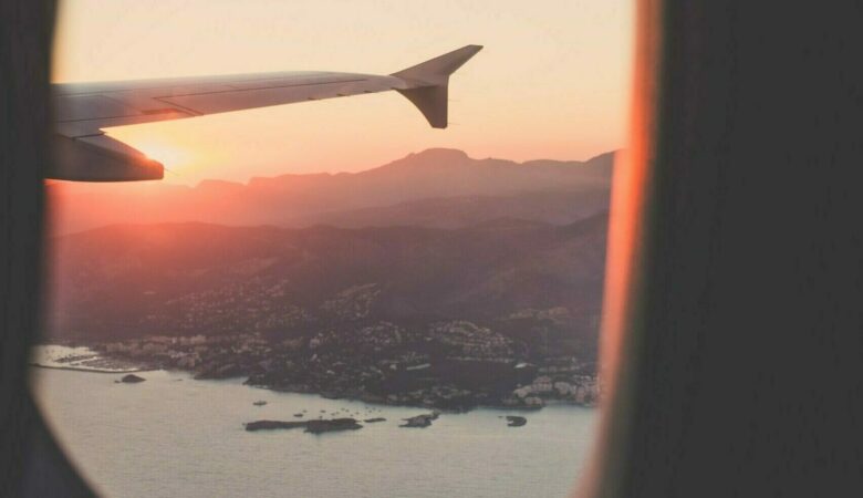 person riding airplane photography